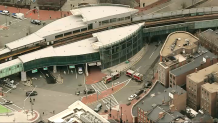 Firefighters at the scene of a manhole fire in Boston