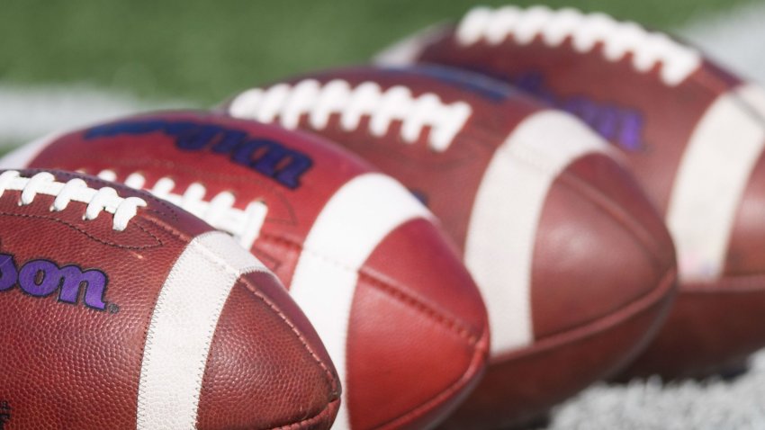 Sep 30, 2017; Madison, WI, USA; Footballs with the college football playoff logo sit on the field during warmups prior to the game between the Northwestern Wildcats and Wisconsin Badgers at Camp Randall Stadium. Mandatory Credit: Jeff Hanisch-USA TODAY Sports