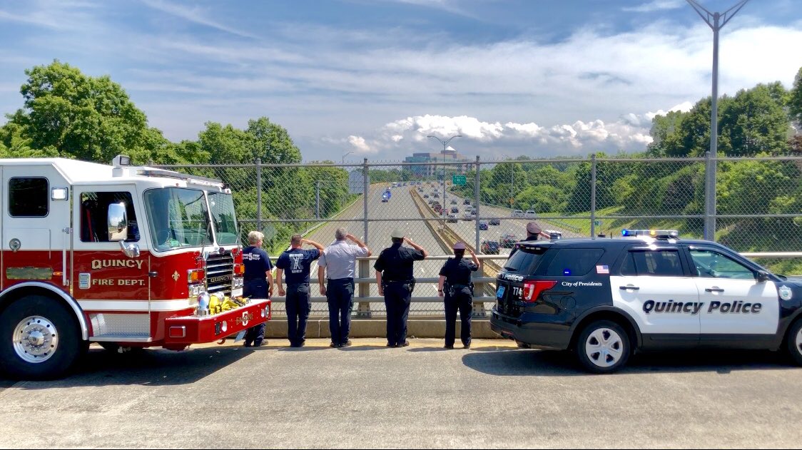 Quincy police and Quincy fire were at attention Sunday as a caravan brought Weymouth Police Officer Michael Chesna’s body to the medical examiner’s office.