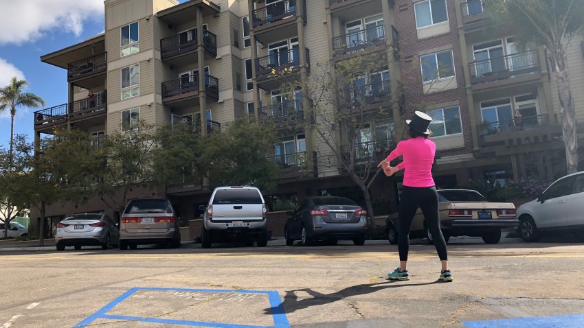 Fitness Instructor stands outside assisted living facility