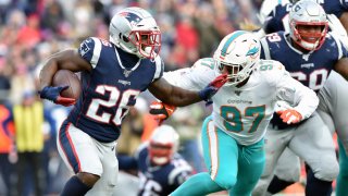 Dec 29, 2019; Foxborough, Massachusetts, USA; New England Patriots running back Sony Michel (26) runs the ball while Miami Dolphins linebacker Trent Harris (97) defends during the second half at Gillette Stadium. Mandatory Credit: Bob DeChiara-USA TODAY Sports