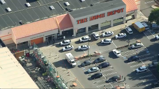 Police cruisers and an ambulance outside a Worcester Home Depot