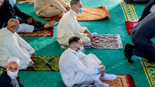 Muslims attend prayers at Essalam mosque while wearing face masks as a preventive measure during Eid al-Adha amid Coronavirus (COVID-19) crisis