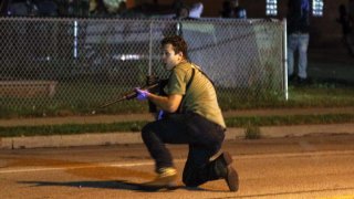 In this file photo, Kyle Rittenhouse is pictured during the third day of protests over the shooting of a black man Jacob Blake by police officer in Wisconsin, United States on August 25, 2020. Rittenhouse, the Illinois man accused of killing two people during the chaotic protests, was due Friday, May 21, 2020, to make his first in-person court appearance.