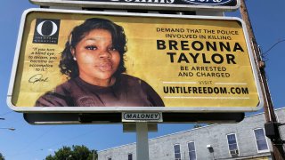 A billboard sponsored by O, The Oprah Magazine, is on display with a photo of Breonna Taylor