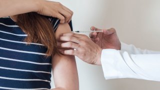 Woman gets a flu shot