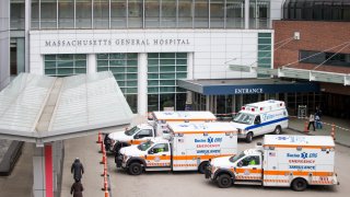 Ambulances pull up to Massachusetts General Hospital in Boston on April 20, 2020.
