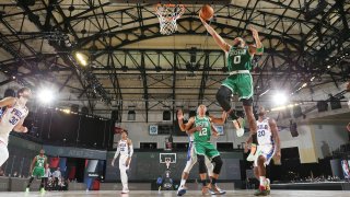 ORLANDO, FL - AUGUST 19: Jayson Tatum #0 of the Boston Celtics shoots the ball against the Philadelphia 76ers during Round One, Game 2 of the NBA Playoffs on August 19, 2020 at The Field House at ESPN Wide World of Sports in Orlando, Florida.