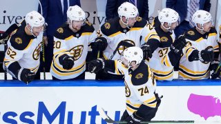 Jake DeBrusk #74 of the Boston Bruins celebrates with his teammates after scoring a goal on Braden Holtby #70 of the Washington Capitals during the third period in an Eastern Conference Round Robin game during the 2020 NHL Stanley Cup Playoffs at Scotiabank Arena on August 09, 2020 in Toronto, Ontario, Canada.