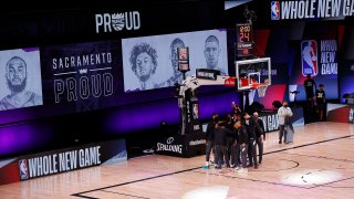 The Sacramento Kings take the court against the New Orleans Pelicans prior to the start of the game of an NBA basketball game Tuesday, Aug. 11, 2020, in Lake Buena Vista, Fla.