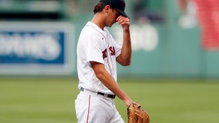 Boston Red Sox's Kyle Hart walks off the field after being taken out during the third inning of a baseball game against the Tampa Bay Rays, Thursday, Aug. 13, 2020, in Boston.
