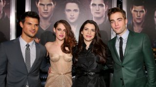 In this Nov. 12, 2012, file photo, actors Taylor Lautner, Kristen Stewart, author Stephenie Meyer, and actor Robert Pattinson arrive at the premiere of Summit Entertainment's "The Twilight Saga: Breaking Dawn - Part 2" at Nokia Theatre L.A. Live in Los Angeles, California.