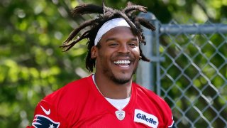 New England Patriots quarterback Cam Newton walks to the field for an NFL football training camp practice, Friday, Aug. 21, 2020, in Foxborough, Mass. (AP Photo/Michael Dwyer, Pool)