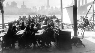 Children attend day camp aboard the Rutherford in New York, 1911. Poor construction and ventilation for school buildings across the country means creative outdoor solutions may be the answer to teaching during a pandemic.