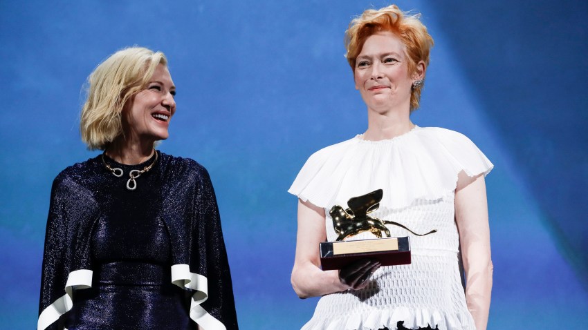 Actress Tilda Swinton, right, holds the Golden Lion for Lifetime Achievement, which was presented by Jury President Cate Blanchett