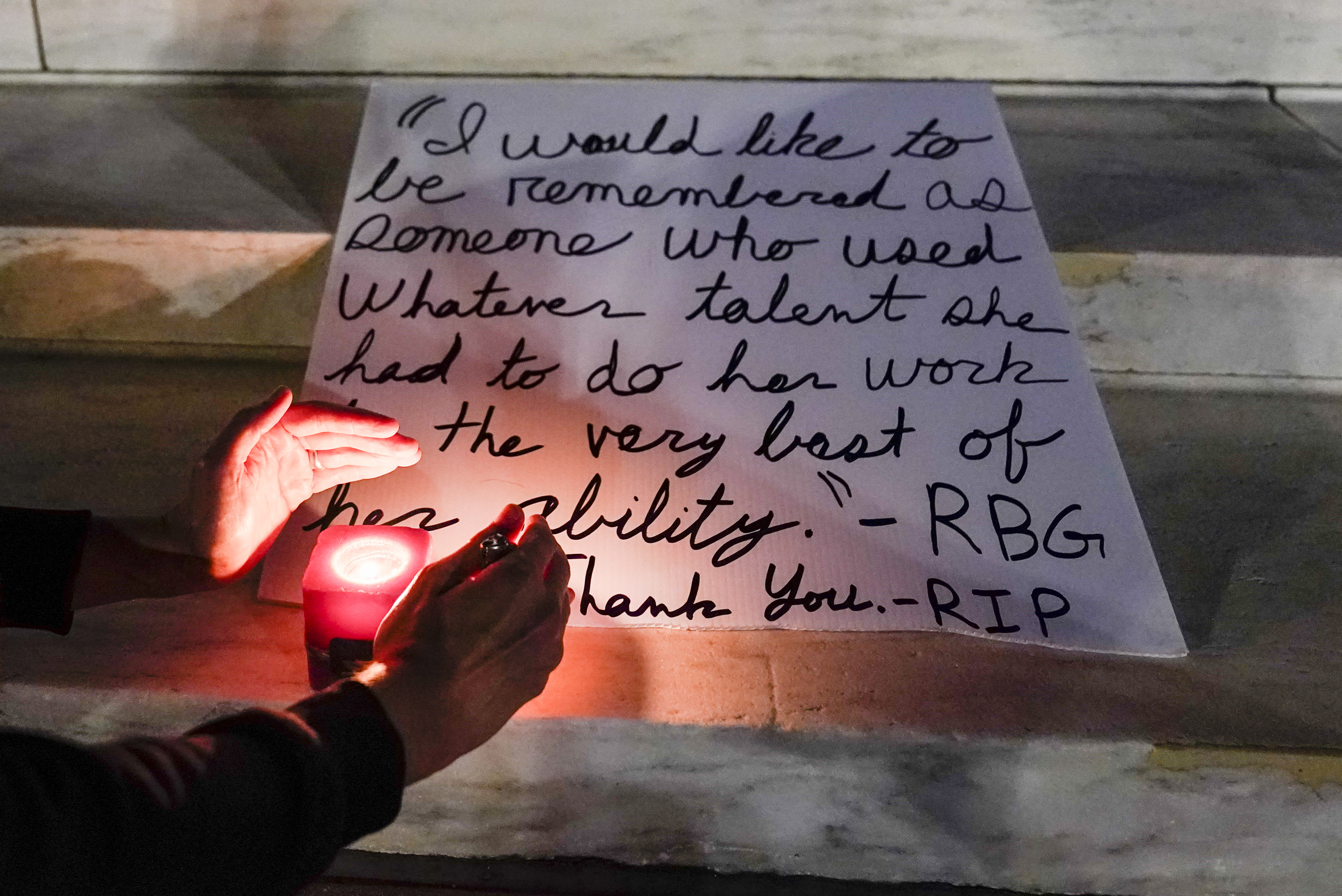 People light candles outside the Supreme Court Friday, Sept. 18, 2020, in Washington, D.C.