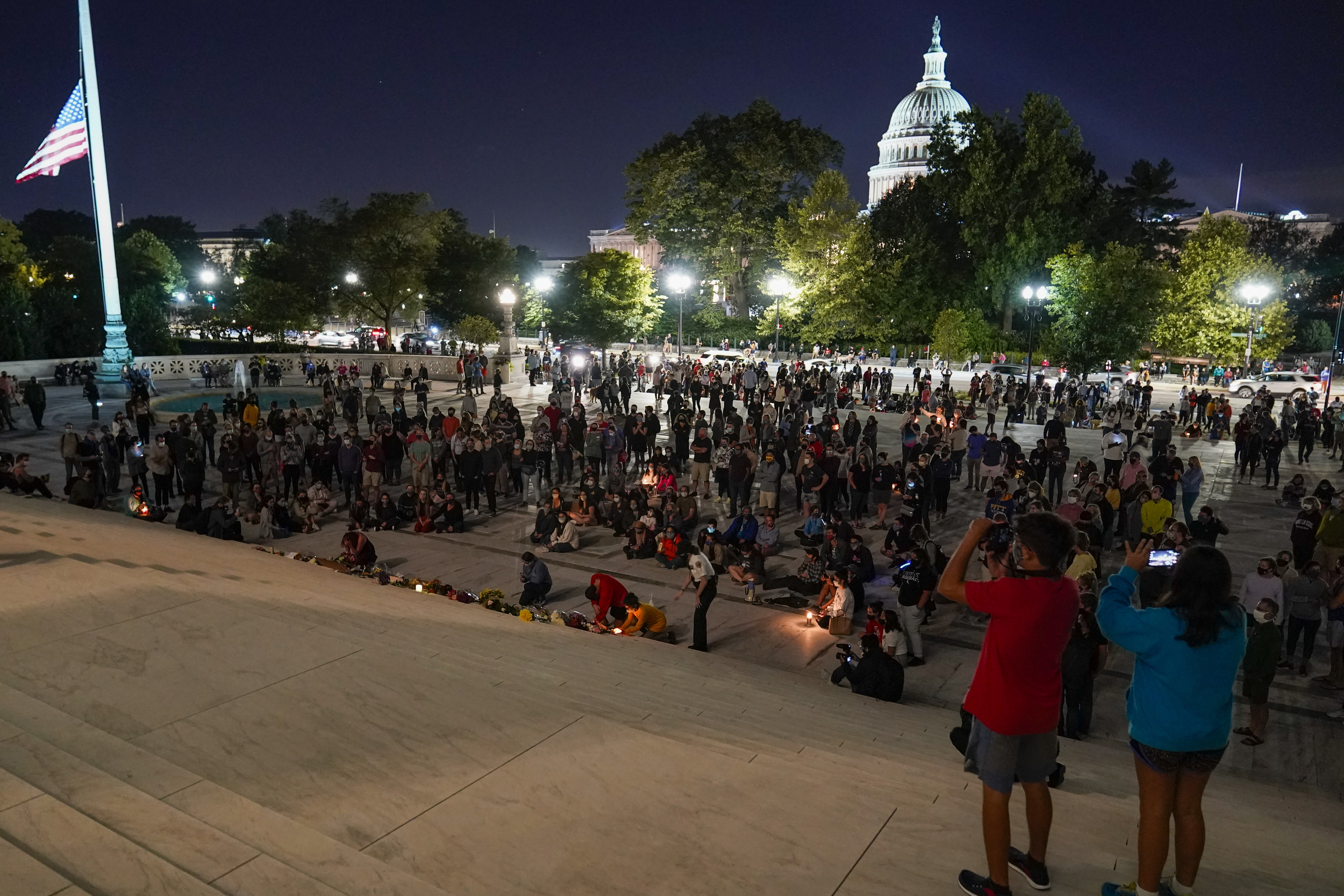 A crowd gathers at the Supreme Court Friday, Sept. 18, 2020, in Washington, D.C., after the Supreme Court announced that Supreme Court Justice Ruth Bader Ginsburg died of metastatic pancreatic cancer at age 87.