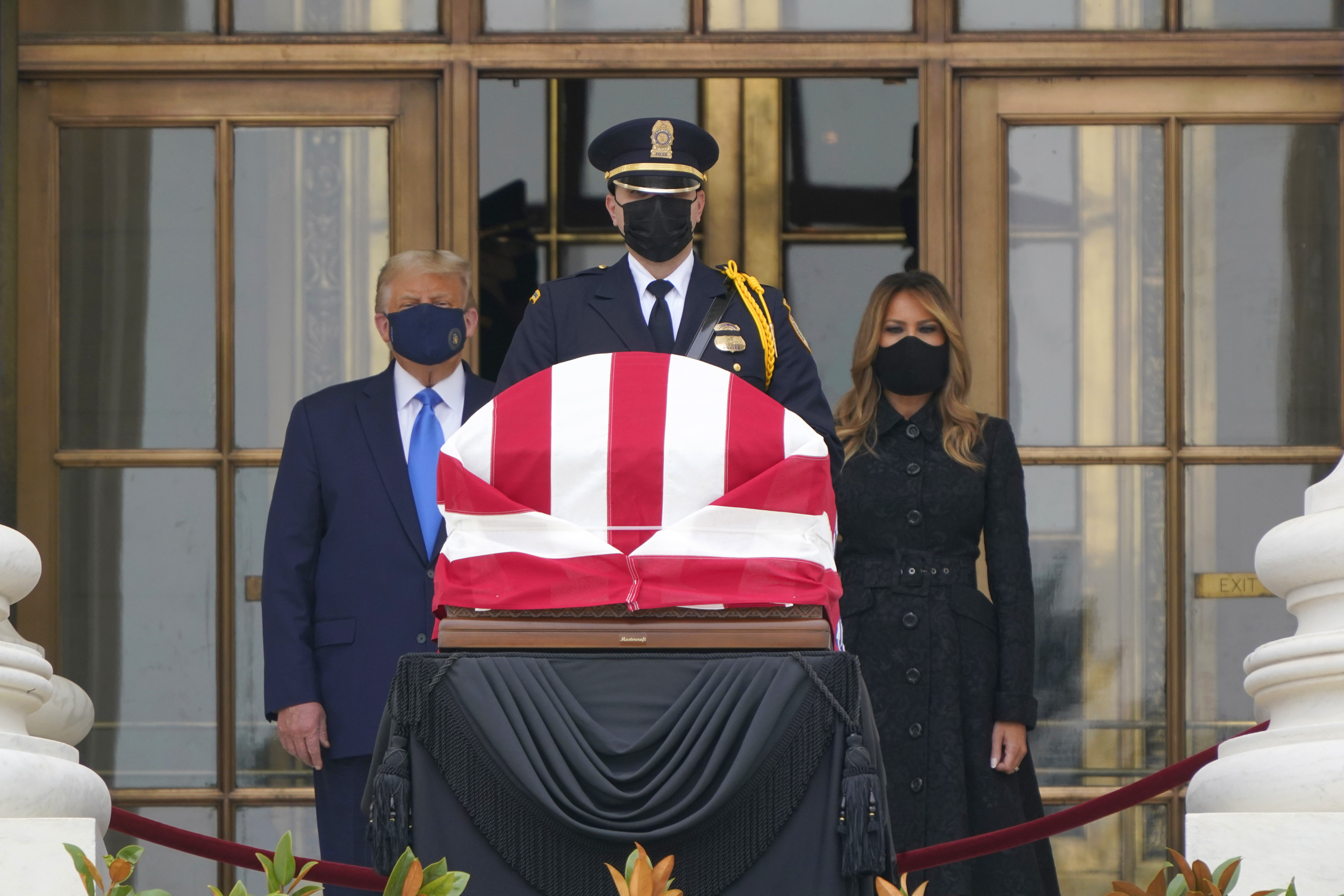 President Donald Trump and first lady Melania Trump pay respects as Justice Ruth Bader Ginsburg lies in repose at the Supreme Court building on Thursday, Sept. 24, 2020, in Washington. Ginsburg, 87, died of cancer on Sept. 18.