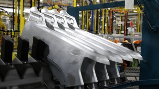 Pickup truck side panels sit on the assembly line at the General Motors Co. plant in Flint, Michigan, U.S., on Tuesday, Feb. 5, 2019.