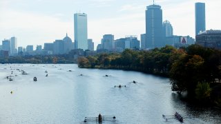 BOSTON, MASSACHUSETTS – OCTOBER 20: Athletes make their way to the starting line in front of the Boston city skyline during the 55th Head of the Charles Regatta on October 20, 2019 in Boston, Massachusetts. (Photo by Maddie Meyer/Getty Images)