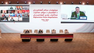 US Secretary of State Mike Pompeo, is broadcasted on the screen, as he delivers a speech during the opening session of the peace talks between the Afghan government and the Taliban in the Qatari capital Doha on September 12, 2020.