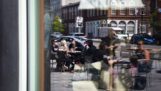 Customers dining outside of a restaurant in Concord, NH