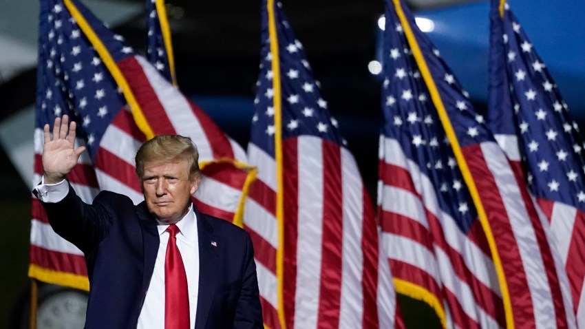 U.S. President Donald Trump waves as he concludes his remarks during a campaign rally at Newport News/Williamsburg International Airport on September 25, 2020 in Newport News, Virginia.