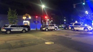 Boston police cruisers at the scene of a shooting in Roxbury