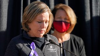 University of Utah President Ruth Watkins, right, looks on as Jill McCluskey, the mother of slain University of Utah student-athlete Lauren McCluskey speaks during a press conference announcing they have reached a settlement in their lawsuit against the university Thursday, Oct. 22, 2020, in Salt Lake City.