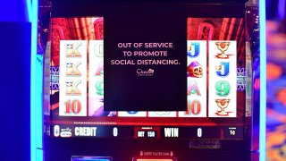 A sign on a slot machine promotes social distancing at Ocean Casino, July 3, 2020, in Atlantic City, New Jersey.