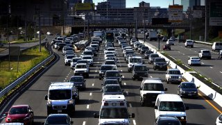 In this Aug. 6, 2020, file photo, Boston traffic at evening rush hour.
