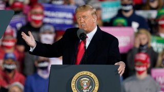 President Donald Trump speaks at a campaign rally at Des Moines International Airport, Wednesday, Oct. 14, 2020, in Des Moines, Iowa.