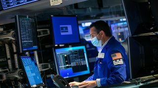 Traders work the floor of the New York Stock Exchange.