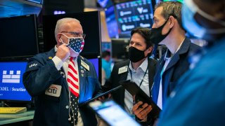 Traders work the floor of the New York Stock Exchange.