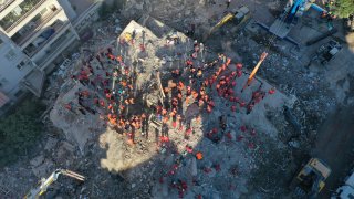 A drone photo shows an aerial view of search and rescue works in the morning hours at debris located in Bayrakli district after a magnitude 6.6 quake shook Turkey's Aegean Sea coast, in Izmir, Turkey on November 01, 2020.