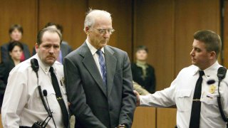 Defrocked priest Paul Shanley, a central figure in the Boston Archdiocese clergy sex abuse scandal, is led from court in handcuffs following his sentencing in Middlesex Superior Court February 15, 2005 in Cambridge, Massachusetts. Shanley was sentenced 12 to 15 years in prison for raping a boy repeatedly in the 1980s.