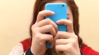 Close up of a teenager on her smartphone