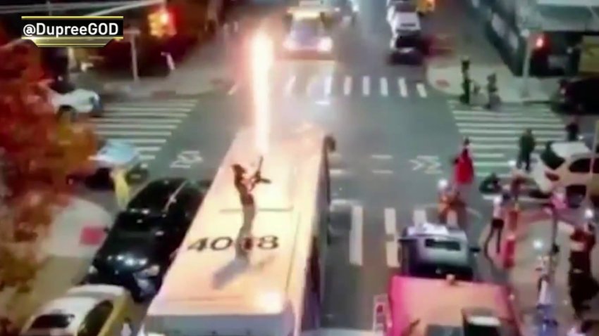 Man with flamethrower on bus