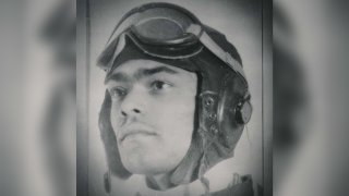 Franklin Macon poses for his official portrait as a Tuskegee Airman with his flight gear.