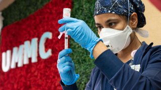 Medical staff member Anita Pandey prepares to administer the Moderna COVID-19 vaccine at the United Memorial Medical Center on December 21, 2020 in Houston, Texas.