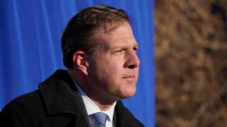 New Hampshire Governor Chris Sununu addresses a gathering outside the Elliot Hospital, Tuesday, Dec. 15, 2020, in Manchester, New Hampshire.