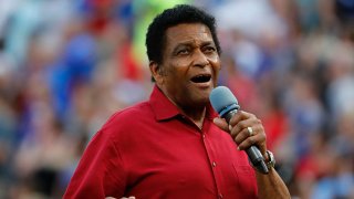 Country Music Hall of Fame member Charley Pride sings the National Anthem before the Cleveland Indians play the Texas Rangers in Arlington, Saturday, July 21, 2018.