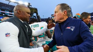 FOXBOROUGH, MA – DECEMBER 29: Head coach Brian Flores of the Miami Dolphins shakes hands with head coach Bill Belichick of the New England Patriots after a Dolphins victory at Gillette Stadium on December 29, 2019 in Foxborough, Massachusetts. (Photo by Adam Glanzman/Getty Images)