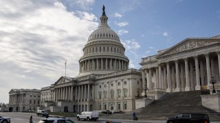 In this Dec. 20, 2020, file photo, Captiol Police vehicles sit outside the U.S. Capitol Building in Washington, D.C.