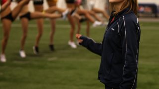 This March 21, 2012, file photo shows New England Patriots Cheerleading Director Tracy Sormanti lead candidates at the Dana Farber Field House during Patriots Boot Camp.