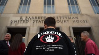 Supporters of Blackwater guards, who are to be sentenced today, gather outside the E. Barrett Prettyman US Court House in Washington, D.C., April 13, 2015.