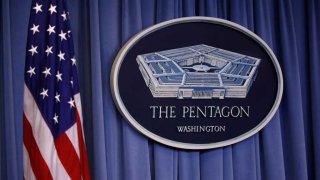 US flag and Pentagon logo