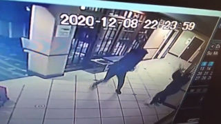 A still from surveillance video showing a man throw a vase at a hotel worker in Manchester, New Hampshire