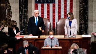 Vice President Mike Pence and House Speaker Nancy Pelosi resume presiding over a Joint session of Congress to certify the 2020 Electoral College results, after supporters of President Donald Trump stormed the Capitol earlier in the day, on Capitol Hill in Washington, U.S. January 7, 2021.