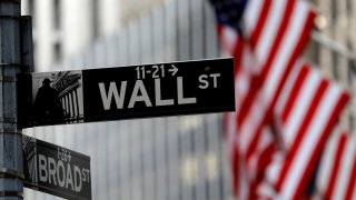 American flags hang from the facade of the New York Stock Exchange (NYSE) building in New York January 28, 2021.